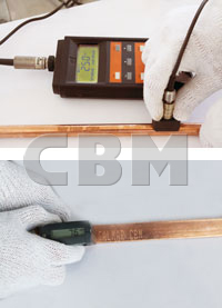 Copper coating thickness measured with a gauge whose sensor touches the rod